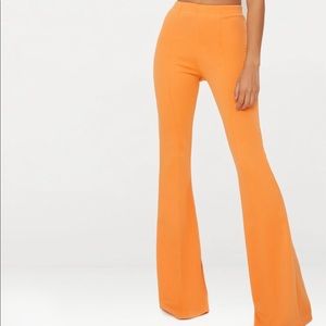 Orange flare pants.